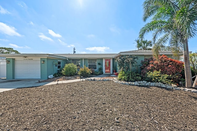 single story home featuring a garage