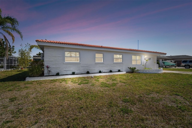 exterior space with a yard