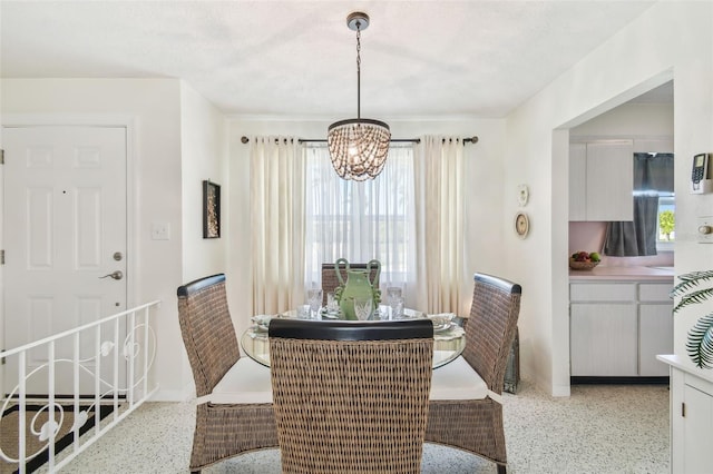 dining space featuring an inviting chandelier