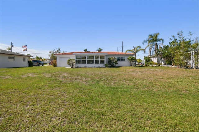 rear view of house with a lawn