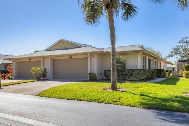 ranch-style home featuring concrete driveway, a front lawn, an attached garage, and stucco siding