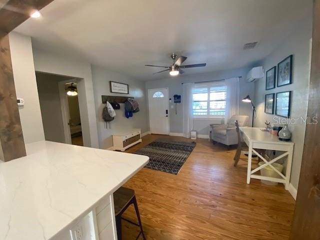 interior space featuring hardwood / wood-style flooring and ceiling fan