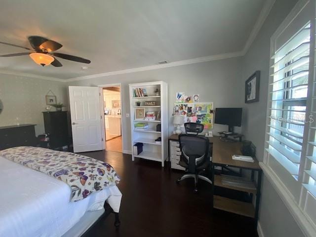 bedroom with crown molding, ceiling fan, and dark hardwood / wood-style flooring