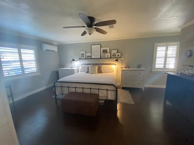 bedroom featuring multiple windows, baseboards, and a wall mounted AC