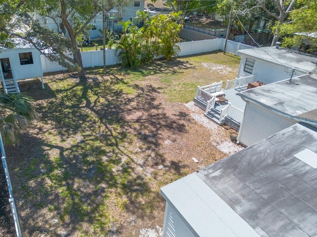 view of yard with a deck and a fenced backyard