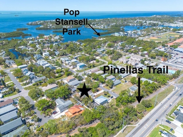 bird's eye view featuring a water view and a residential view