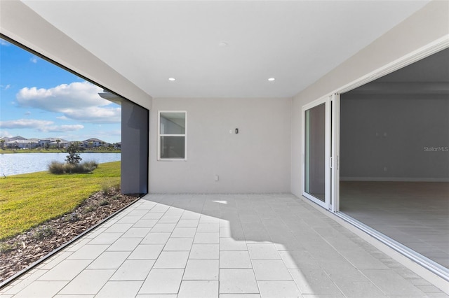 view of patio featuring a water view