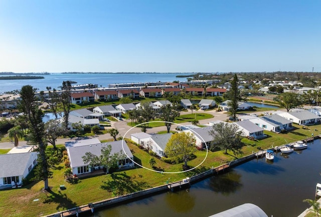 birds eye view of property featuring a water view and a residential view