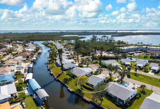 bird's eye view with a water view and a residential view