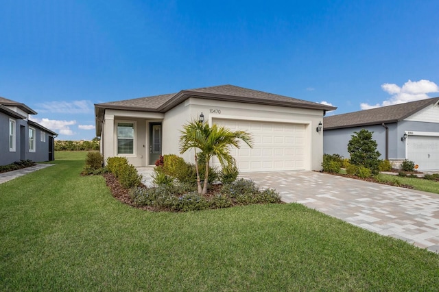 ranch-style home featuring a garage and a front yard