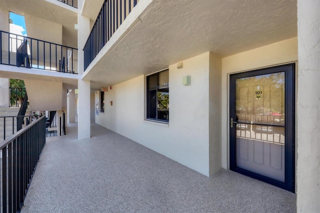 entrance to property with a balcony