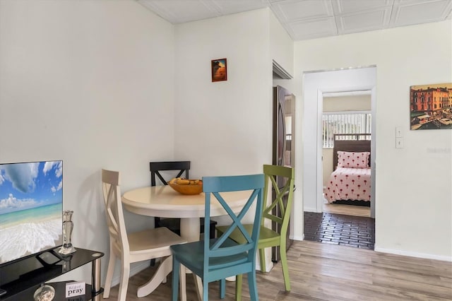 dining area with light hardwood / wood-style flooring