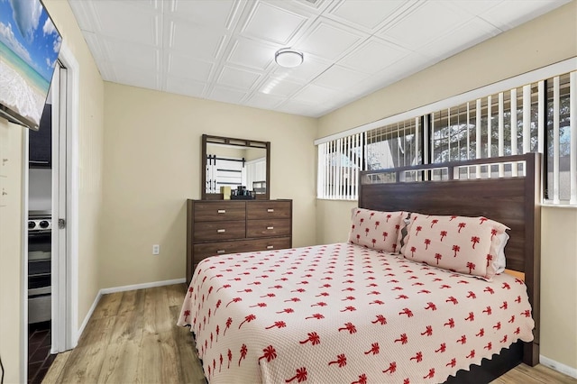 bedroom with light wood-type flooring