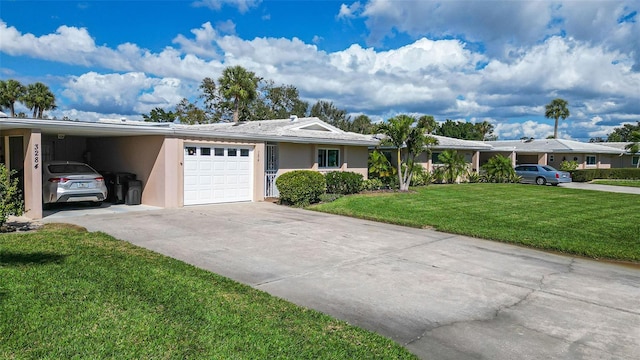 single story home featuring a garage, concrete driveway, a front lawn, a carport, and stucco siding