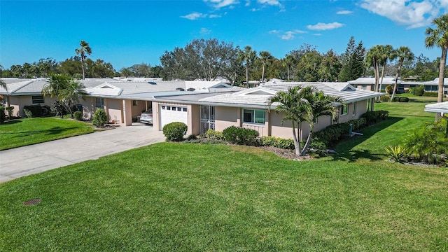 ranch-style home featuring a garage, a front yard, concrete driveway, and stucco siding