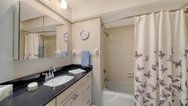 bathroom featuring shower / bathtub combination with curtain and vanity