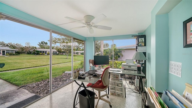 sunroom featuring a ceiling fan