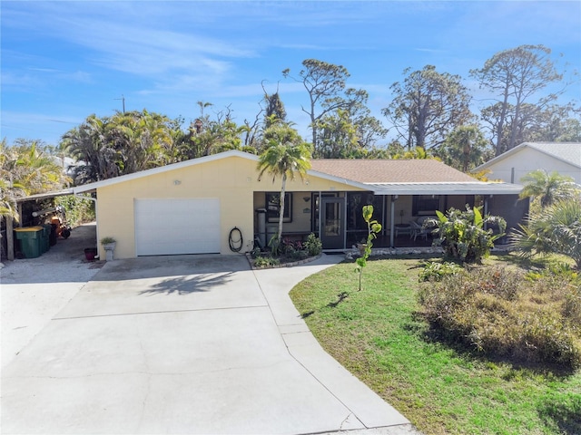 ranch-style house with a garage and a front lawn