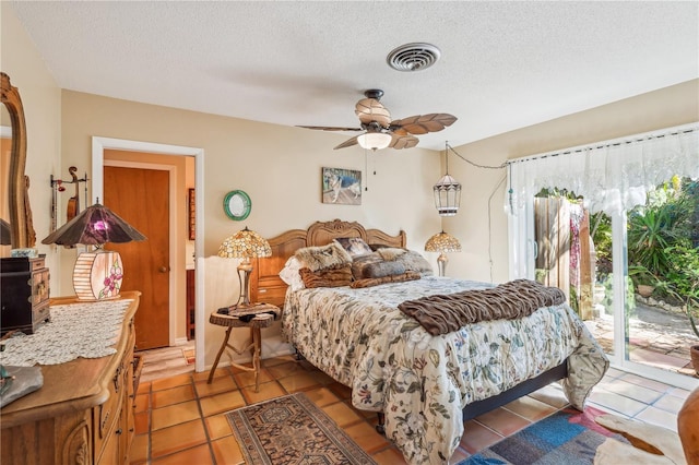 bedroom with light tile patterned flooring, ceiling fan, access to exterior, and a textured ceiling