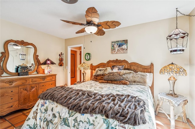 tiled bedroom with ceiling fan