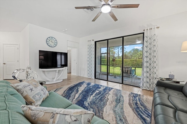 living room with a ceiling fan, light tile patterned flooring, and visible vents