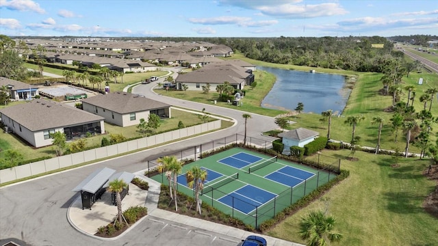 drone / aerial view featuring a water view and a residential view