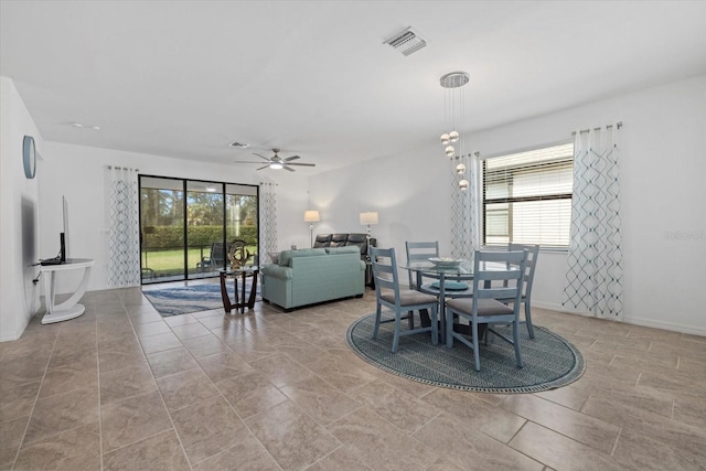 dining area featuring visible vents, ceiling fan, and baseboards