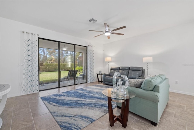 living area with ceiling fan, light tile patterned floors, visible vents, and baseboards