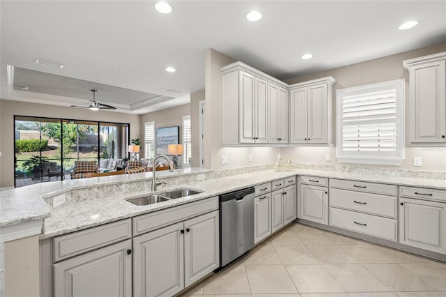 5556 Cantucci St, Nokomis, FL 34275 - kitchen with dishwasher, a sink, ceiling fan, a raised ceiling, and recessed lighting