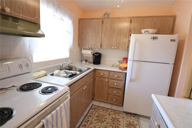 kitchen featuring backsplash, white appliances, sink, and light tile patterned floors