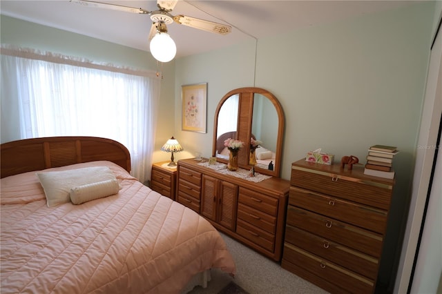 bedroom with ceiling fan and carpet