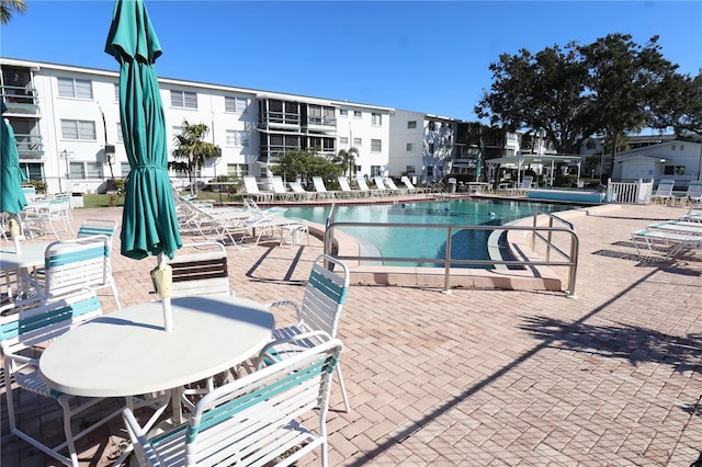 view of swimming pool featuring a patio