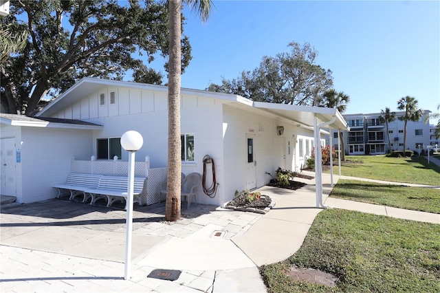 view of property exterior with a yard