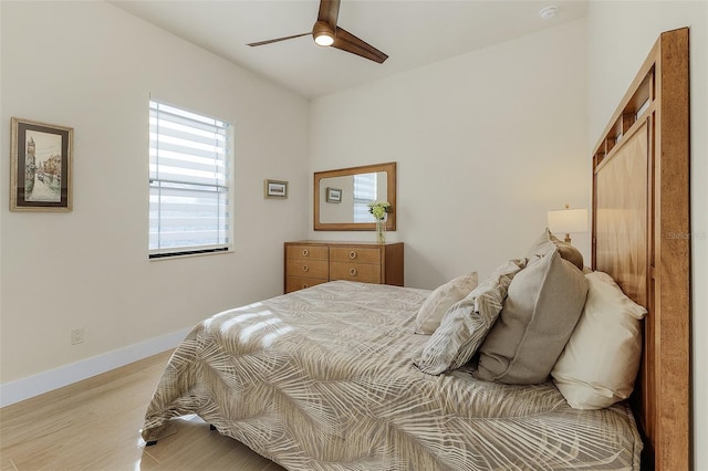 bedroom featuring ceiling fan and light hardwood / wood-style floors