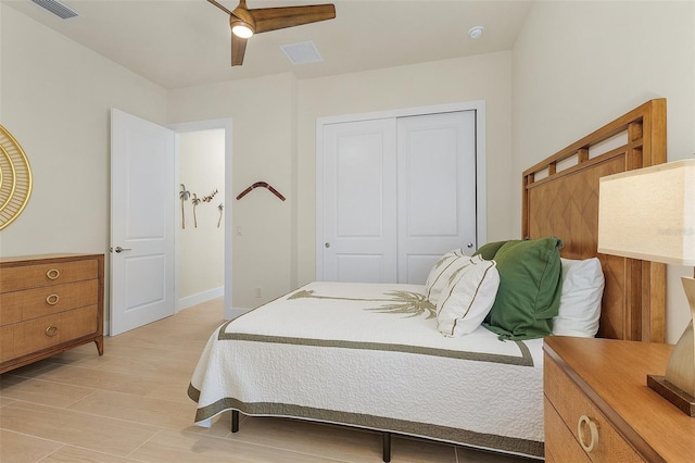 bedroom featuring a closet, ceiling fan, and light hardwood / wood-style flooring