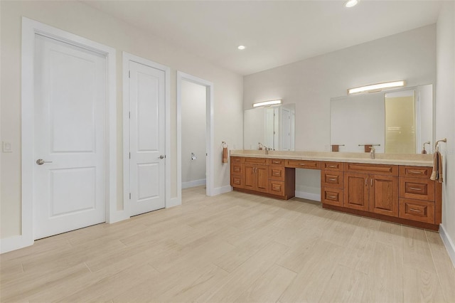 bathroom featuring vanity and hardwood / wood-style floors