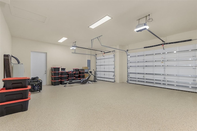 garage featuring a garage door opener and electric panel