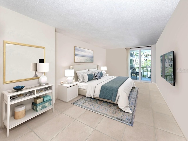 bedroom featuring light tile patterned floors, a textured ceiling, and access to outside