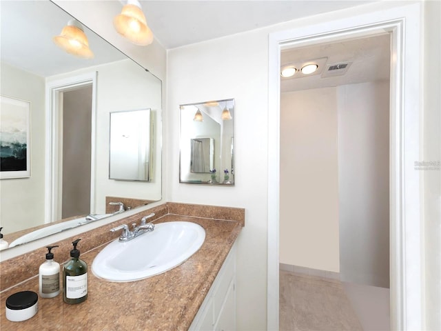 bathroom featuring vanity and visible vents