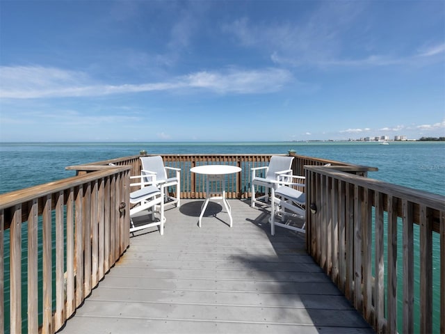 wooden deck featuring a water view