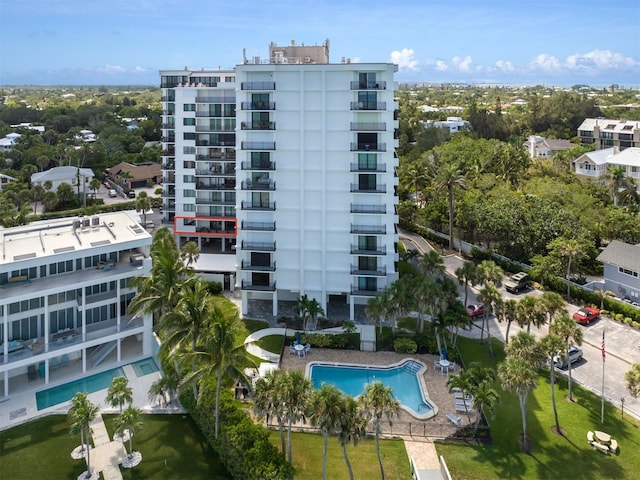 view of building exterior with a community pool