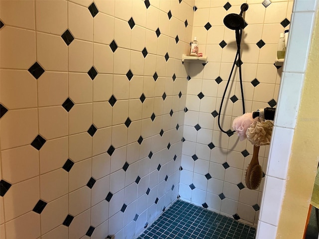 bathroom with tiled shower