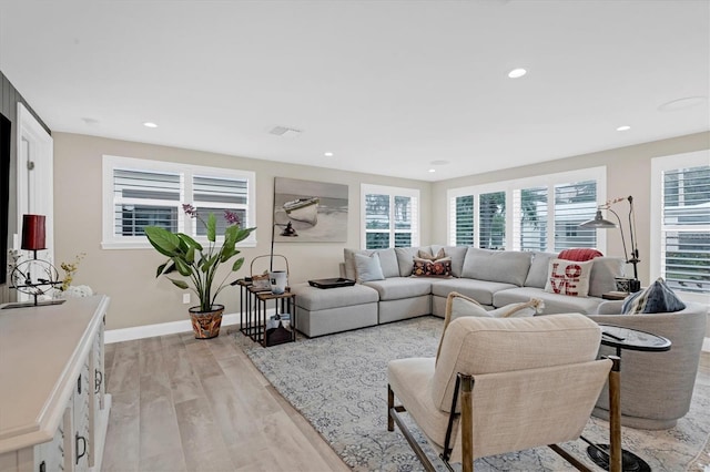 living room with light hardwood / wood-style flooring