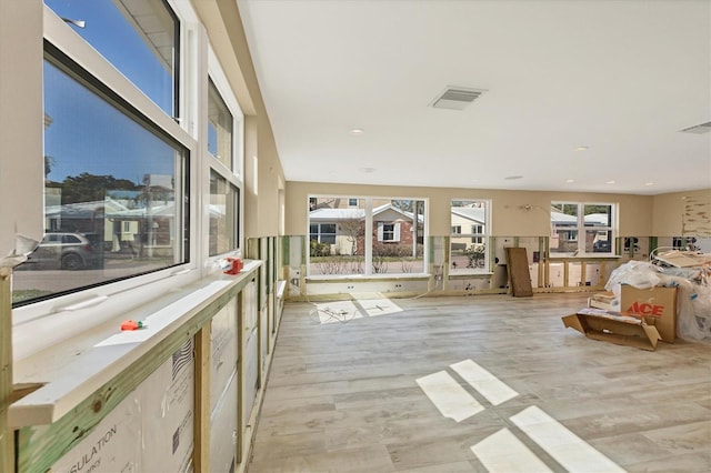 unfurnished living room featuring light hardwood / wood-style floors