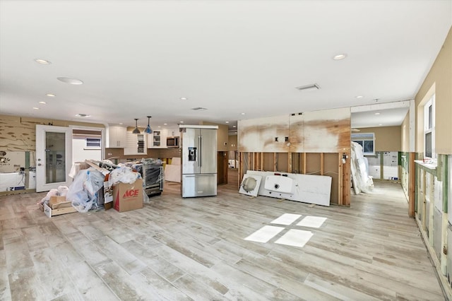 unfurnished living room featuring light hardwood / wood-style floors