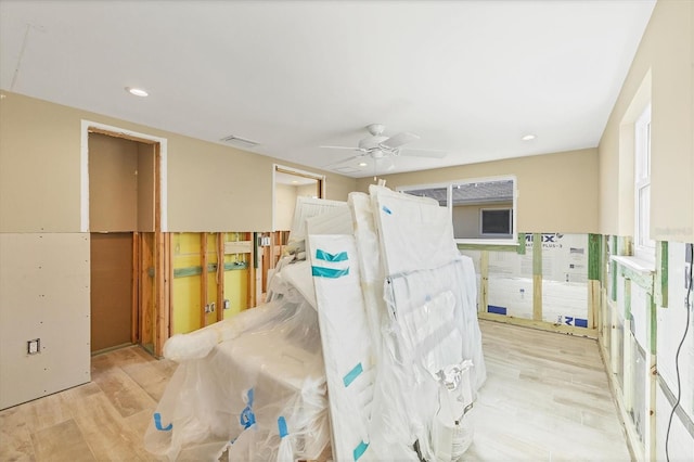 interior space featuring ceiling fan and light wood-type flooring