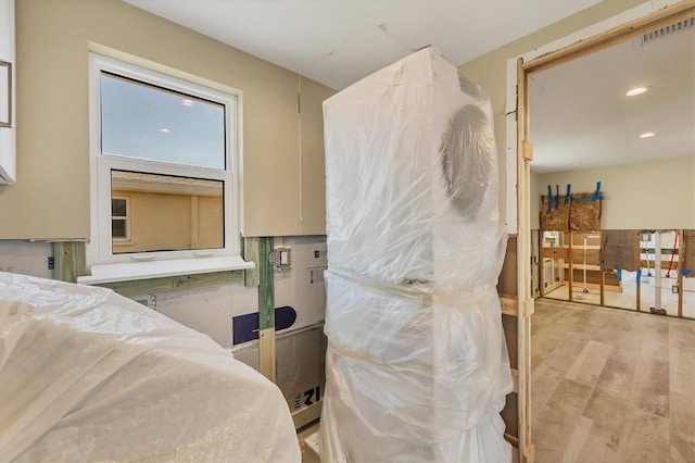 bathroom with hardwood / wood-style flooring