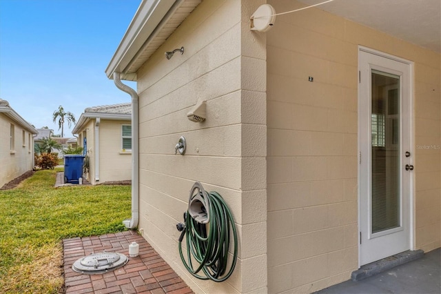 view of side of home featuring a yard