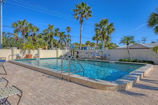 view of pool featuring a patio