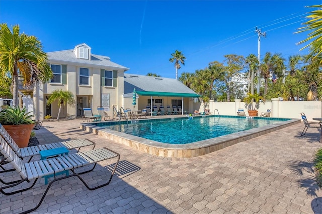 view of swimming pool with a patio